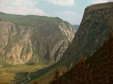 river through mountains in Altai with some bronze autumn leaves